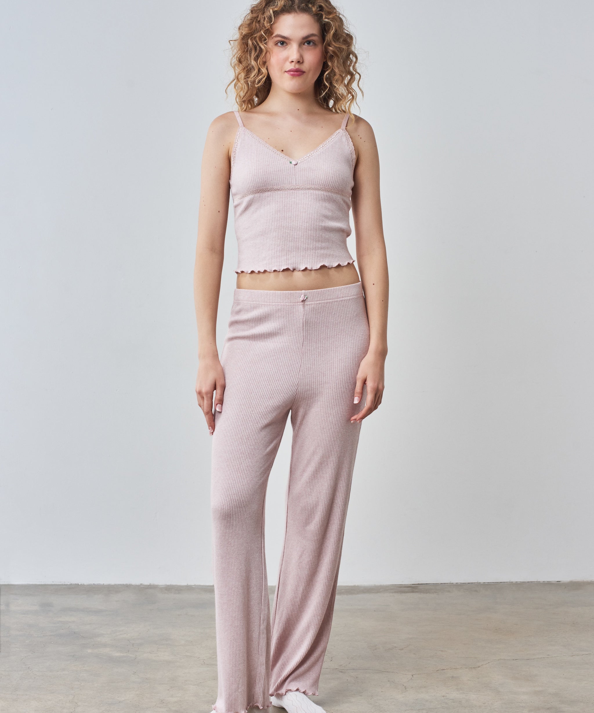 Pale pink cami top and trouser set with rose trims.